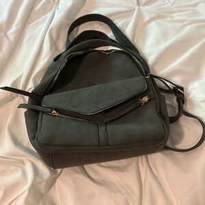 black and gold mini backpack